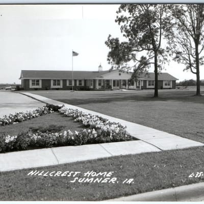 Exterior view of Hillcrest Home with landscaping