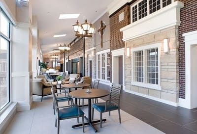 Bright common area with seating and decorative lamps