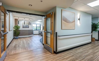 Bright interior hallway leading to a common area