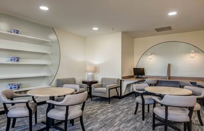 Interior common area with seating and a computer station