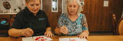 Residents and staff engaged in an art activity
