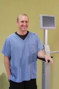 Mason Health Care Center, Nursing Home in Warsaw, IN — Male healthcare worker in scrubs beside medical equipment