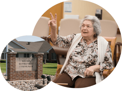 A resident gestures joyfully in a common area
