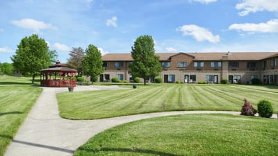Well-maintained landscaped garden with a gazebo and building
