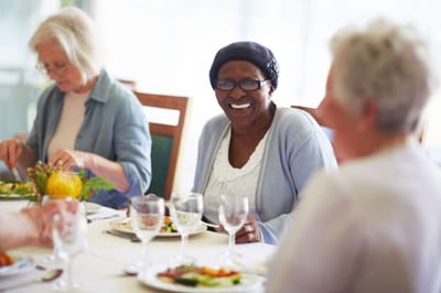 Residents enjoying a meal in the dining room