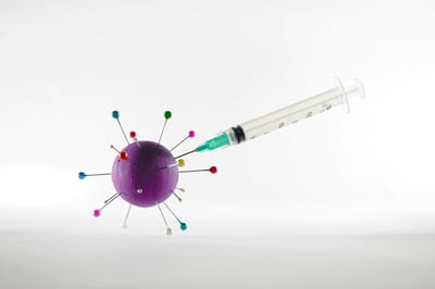 Conceptual image of a virus and syringe