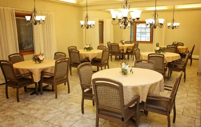 Bright dining room with round tables and chairs