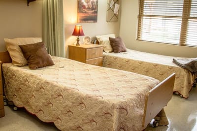 Cozy shared bedroom with two beds and warm lighting