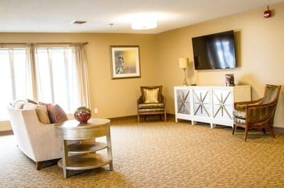 Bright common area with seating and TV