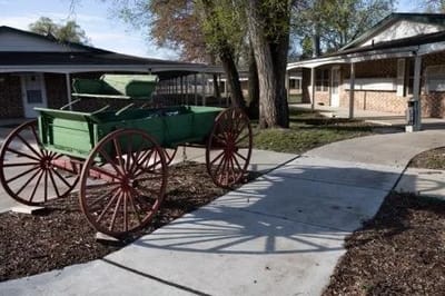 Outdoor path with a vintage cart in a courtyard