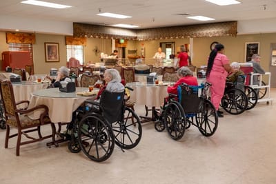 Residents enjoying meals in a dining area
