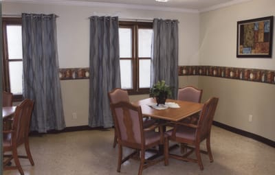 A cozy dining area with wooden tables and chairs