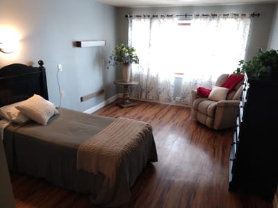 Cozy private room with a bed and natural light