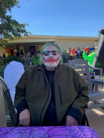 Resident dressed as the Joker at a celebration