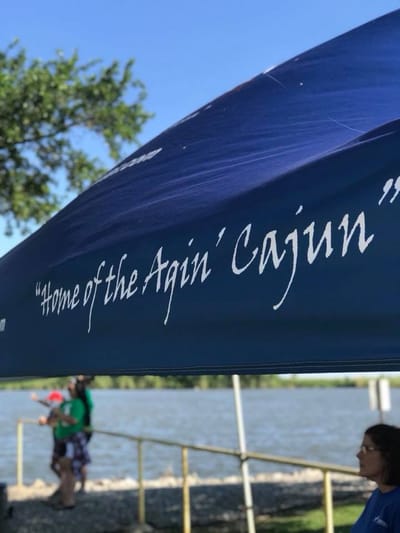 Outdoor event tent with water in the background