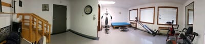 Interior view of a therapy room with exercise equipment