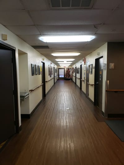 A long corridor decorated for the holidays