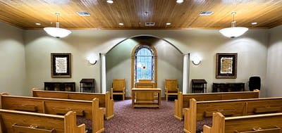 Interior view of a chapel with wooden seating