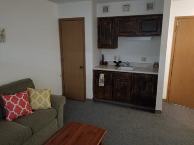 Cozy interior of a resident's room with a kitchenette
