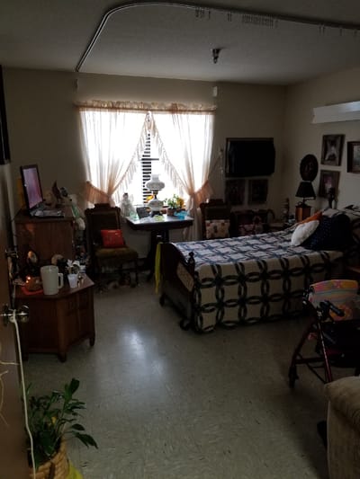 Cozy resident room with personal decorations and a bed