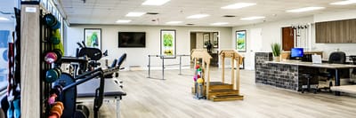 Interior view of a therapy room with exercise equipment
