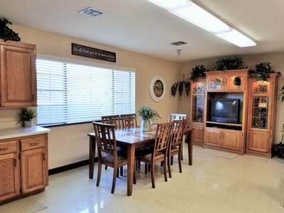Bright dining area with a large wooden table