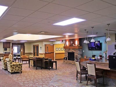 Interior common area with seating and a fireplace