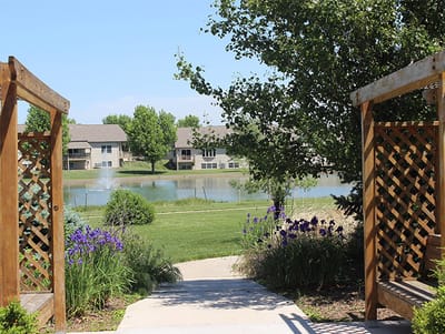 Beautiful garden view with a pond and blooming flowers