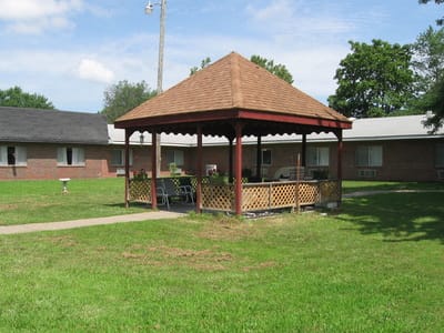 Gazebo in a green outdoor space of a facility