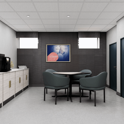 Interior view of a meeting room with chairs and a coffee station