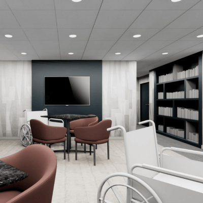 Bright common area with seating and bookshelf