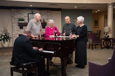 Residents enjoying music during a social gathering