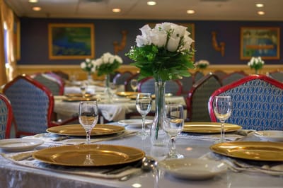 Beautifully arranged dining table with flowers