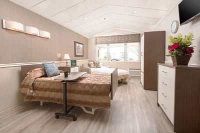 Interior view of a cozy resident room with two beds