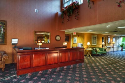 Interior view of a facility lobby with seating and reception