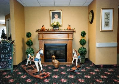 Decorative common area with rocking horses and plants