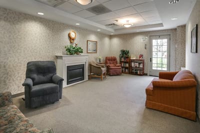 Indoor common area with seating and bookshelves