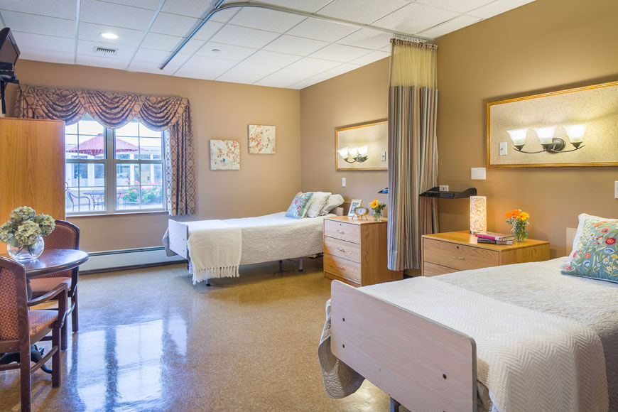 Bright and inviting twin bedroom with seating area