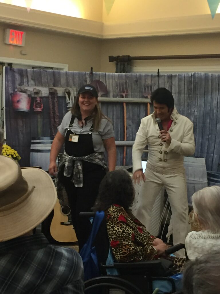 Residents enjoying a performance in a common area