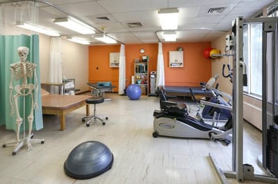 Therapy room with fitness equipment and exercise tools