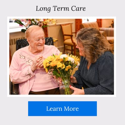 Staff member interacting with a resident in a common area