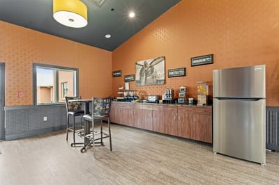 Bright common area with coffee station and seating