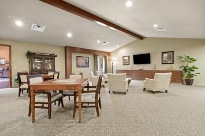 Bright common area with seating and a table