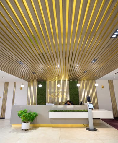 Modern reception area with indoor greenery and stylish decor