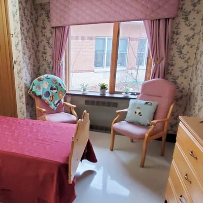 Comfortable resident room with chairs and decorations