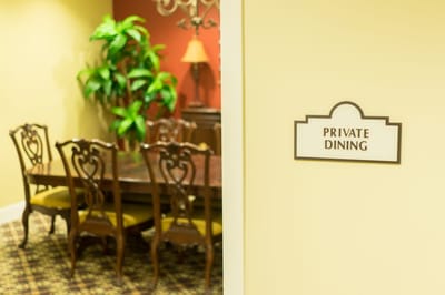 Private dining area with a large table and chairs