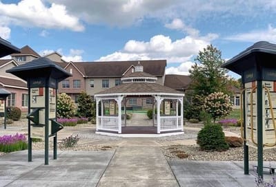 View of an outdoor gazebo surrounded by landscaping