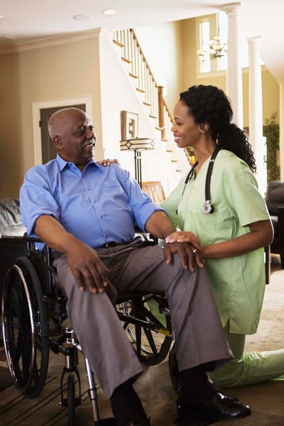 A caregiver interacting with a resident in a facility