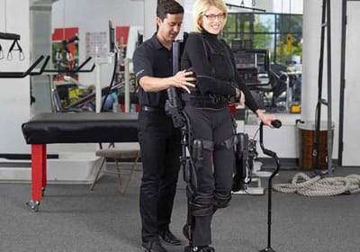 Therapist assisting a resident with mobility equipment