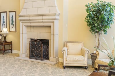 Cozy lounge area with a fireplace and armchairs